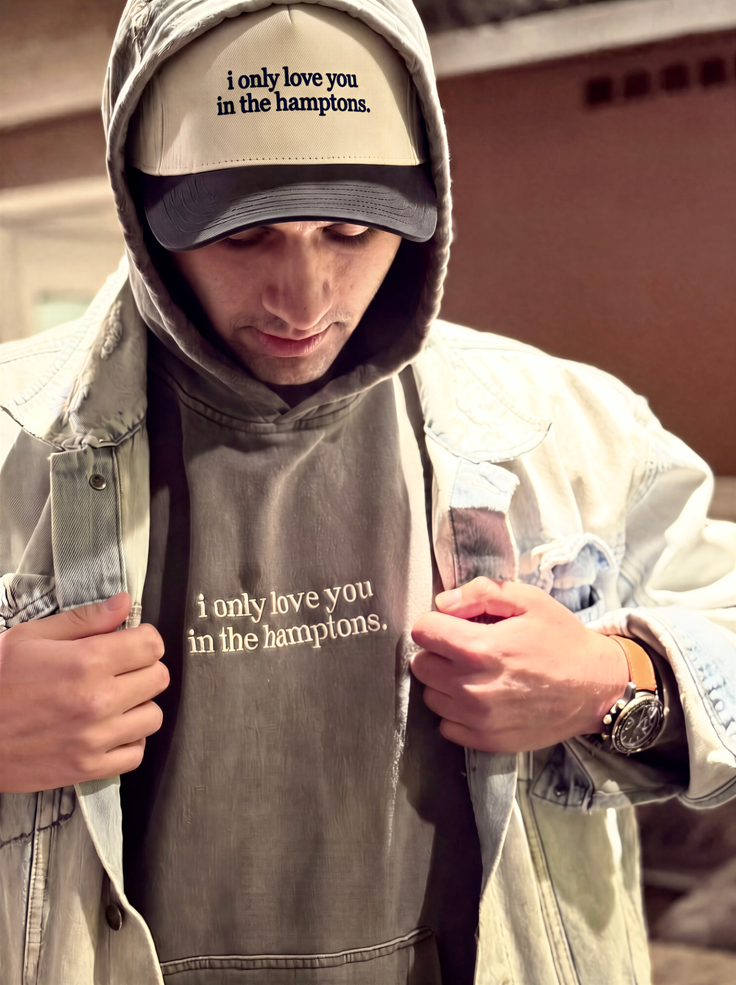 The original print-on-demand sample hoodie and cap reading i only love you in the hamptons.